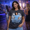Woman wearing a t-shirt with 'Birthday Queen' design in a festive setting.