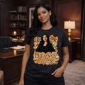 Woman wearing a black t-shirt with 'Boss Lady' design in a room with wooden furniture.